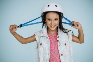 Portrait of a girl wearing scooter helmet